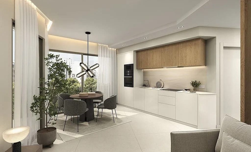 Гостиная с кухней открытой планировки в новой квартире.