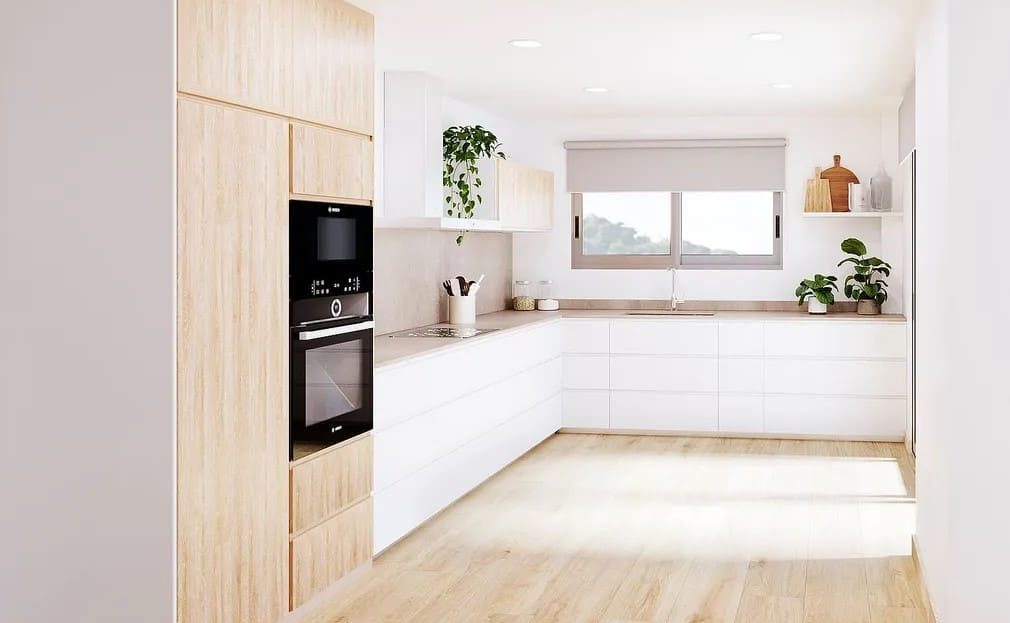 Кухня открытого типа с белыми шкафами и деревянными акцентами.