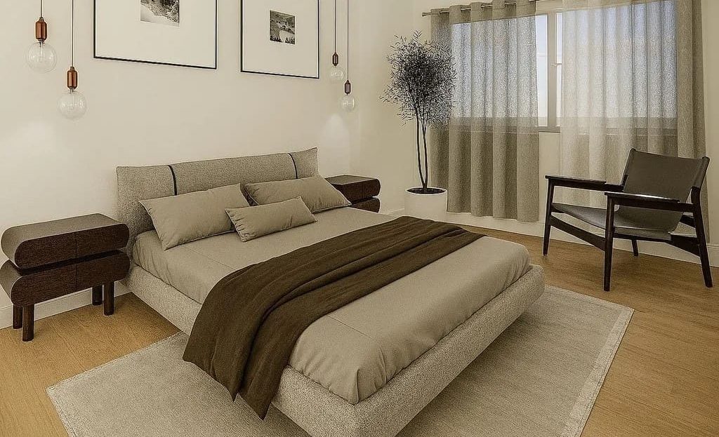 Просторная спальня с двуспальной кроватью и естественным освещением.