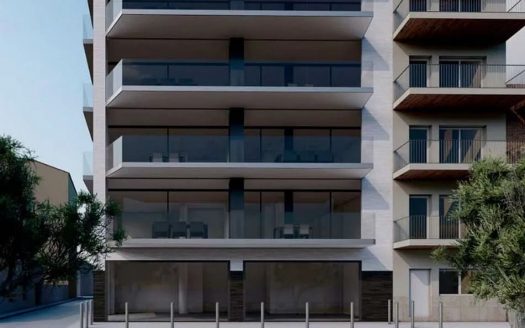 Фасад нового жилого комплекса в Сан-Антонио-де-Калонже с современными террасами