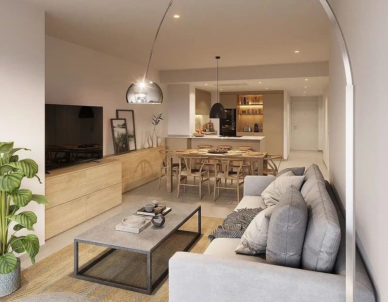 Гостиная в светлых тонах с современной мебелью и телевизором.