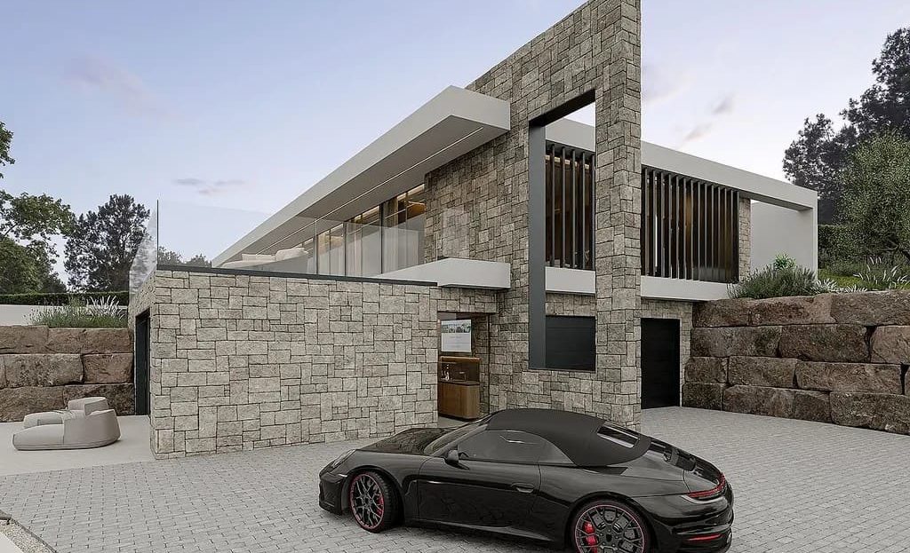 Фасад дома с подъездом и парковочной зоной.