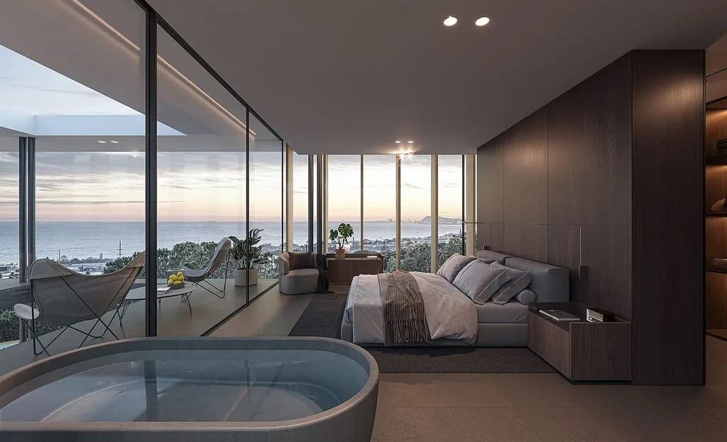 Зона отдыха с диваном и видом на море через панорамные окна